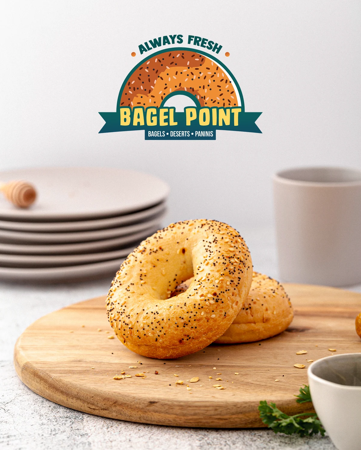 Bagel Point sesame bagel with logo, lifestyle shot