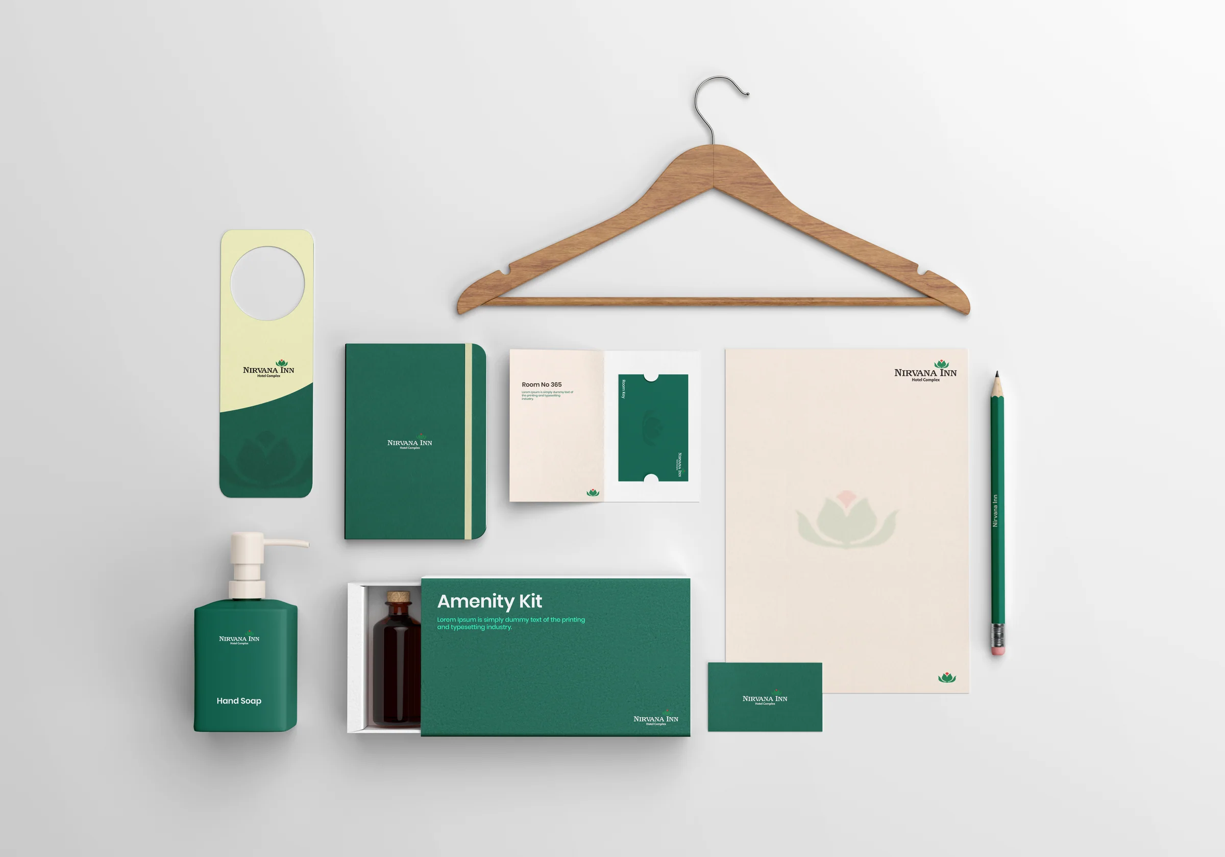 Nirvana Inn stationery and amenity kit flatlay — notebook, room key sleeve, letterhead, hand soap and amenity kit box