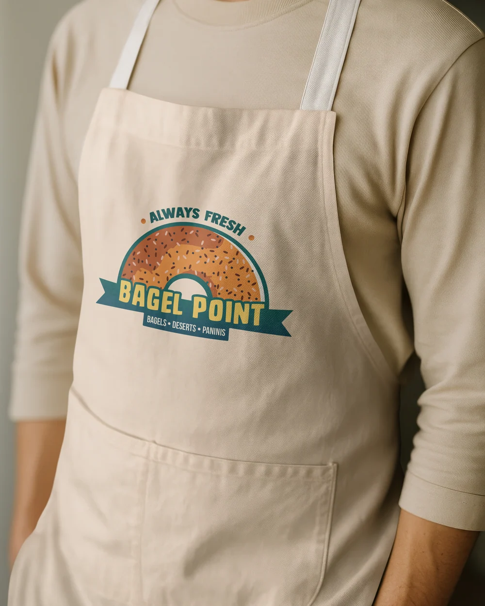 Bagel Point logo printed on a staff apron